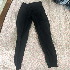 Lululemon in dance studio joggers full length.